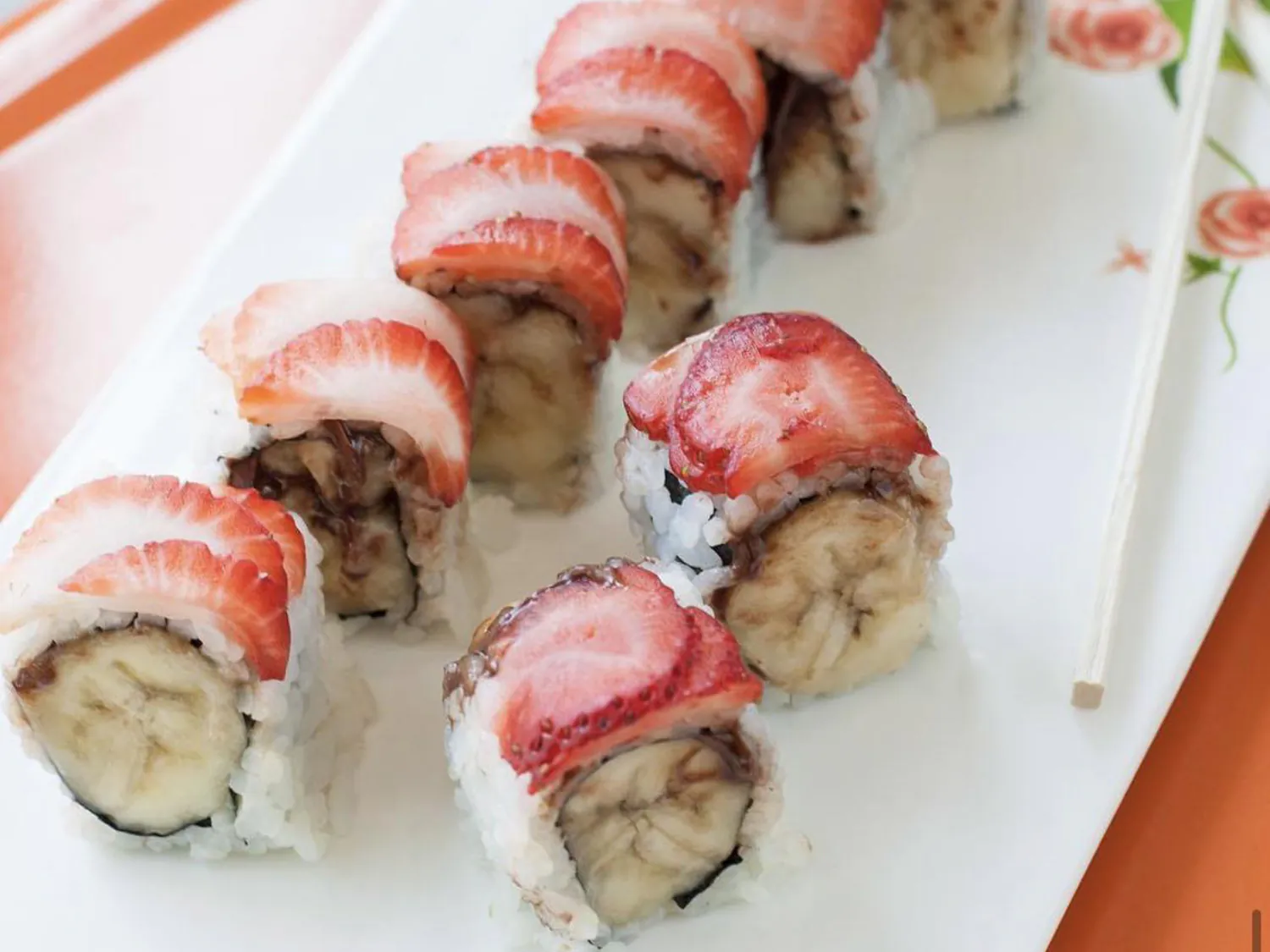 Strawberry and banana sushi roll on white plate at Sushi Yoshi，a Japanese Restaurant in Brooklyn
